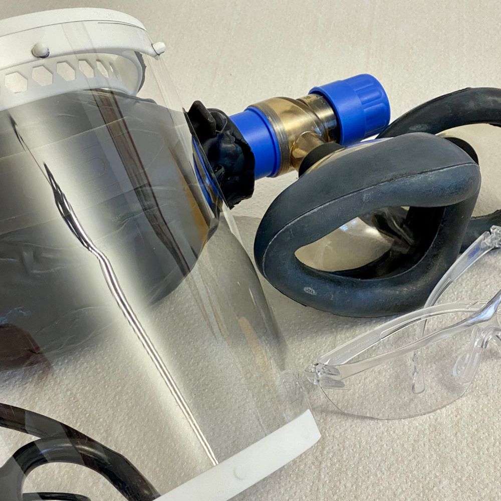A clear polycarbonate full face shield on its ratcheting headgear