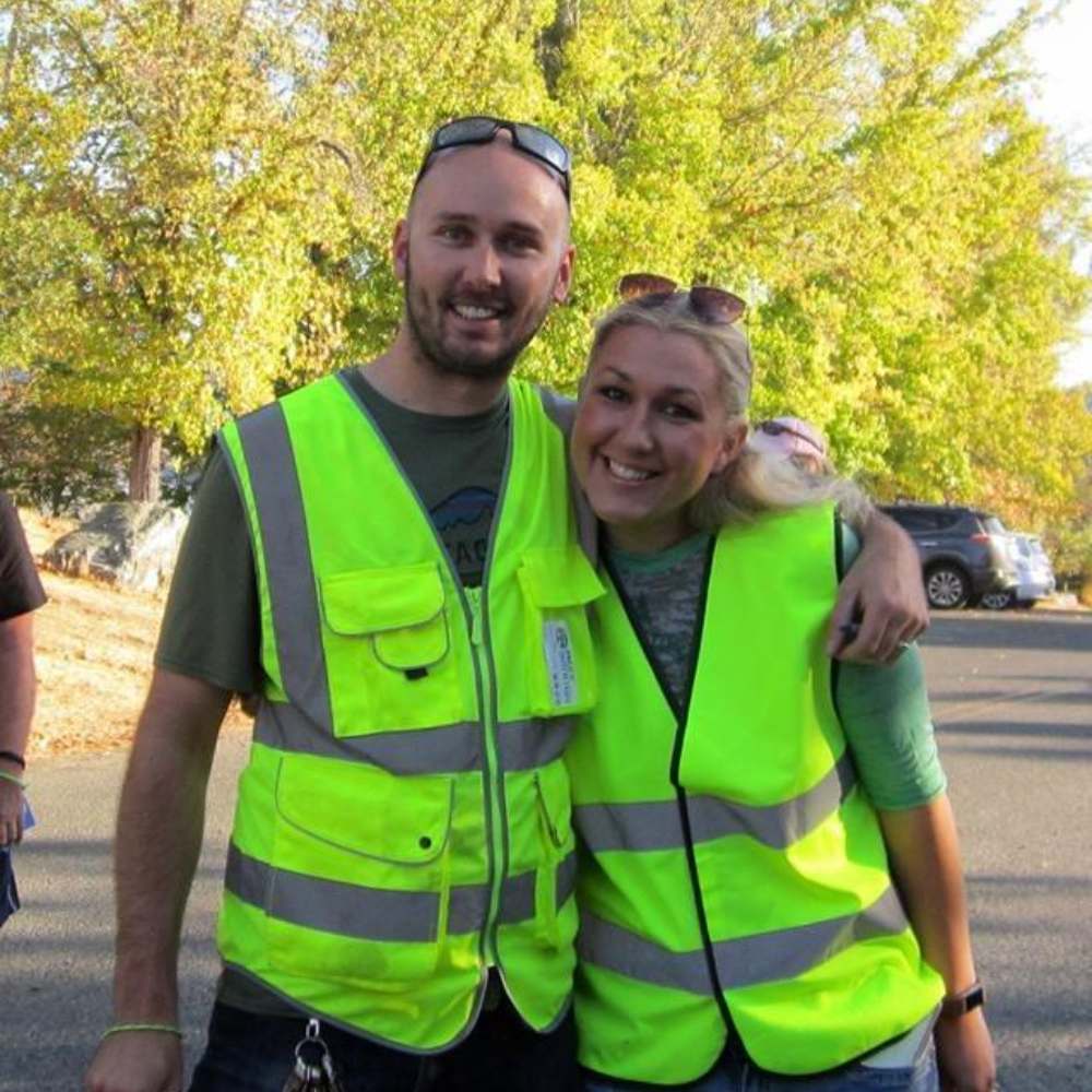 A high visibility security vest with reflective strips and multiple pockets